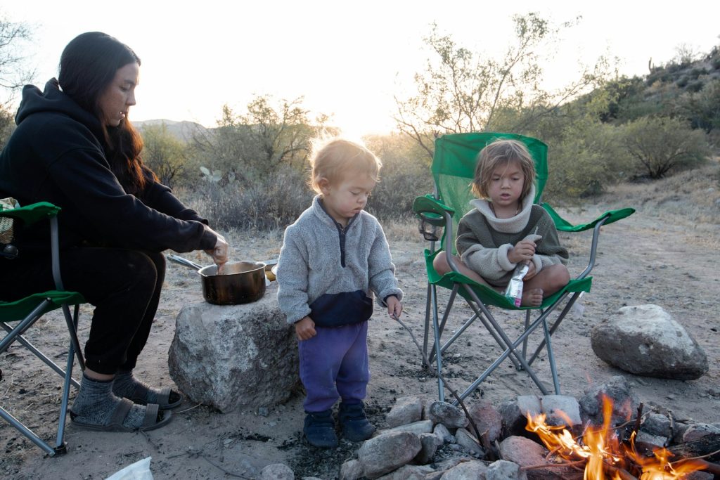 Campfire Donuts supervise children around campfire