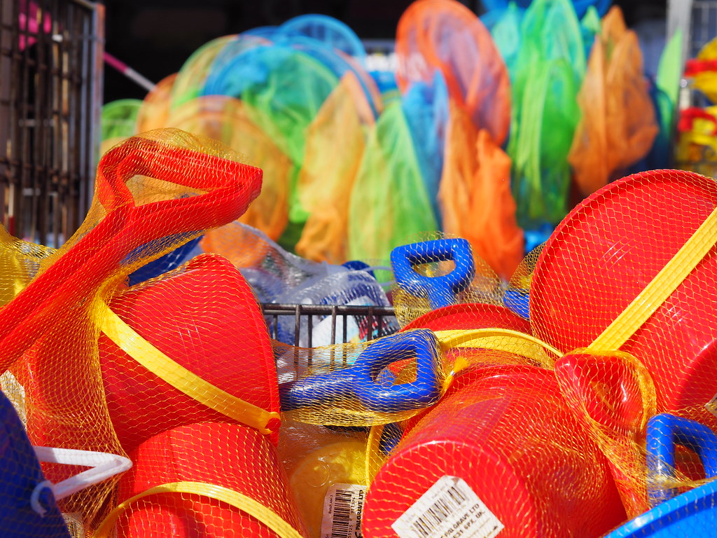 Beginners Guide to Beach Camping sand buckets and beach balls can keep everyone entertained